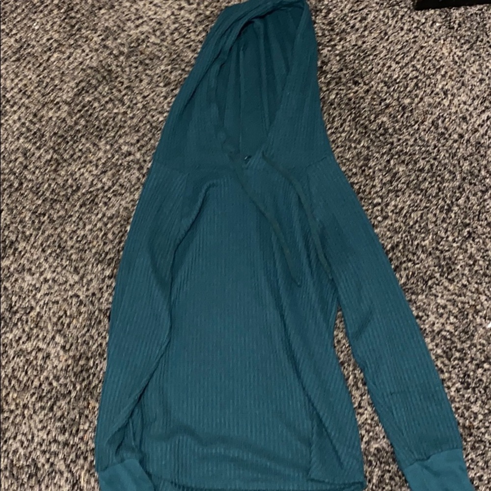 A green hooded sweater